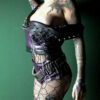 Purple snd black faux leather vest with metal spikes / studs on the neckline. Fully lined with viscose cotton and lacing on the side
